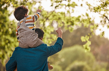 Image showing Piggyback, relax and father with child in park for support, playful and games. Love, freedom and adventure with man carrying baby in nature for family, summer and vacation together with mockup space