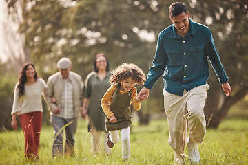 Image showing Family, park and parents with children in nature for playing, bonding and running together in field. Happy grandparents, mother and father with girl relax outdoors on holiday, adventure and vacation
