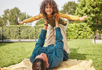 Image showing Father, kid and plane game in park, outdoor or nature on holiday, freedom or care for bonding. Excited young child, dad and lift for airplane, smile or free for play on vacation in portrait on ground