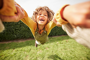 Image showing Child, spin and outdoor in pov, holding hands and happy for game with parent, holiday and backyard. Excited young kid, smile and swing in air, fast and lawn for play on vacation in summer sunshine