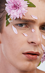 Image showing Plant, skincare and flowers with portrait of man in studio for beauty, natural and creative. Glow, cosmetics and spring with face of model on white background for makeup, spa and floral wellness