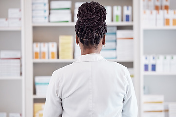 Image showing Pharmacy, pharmacist back and medicine shelf for healthcare inventory, stock management and boxes check. Medical person or doctor search for pills or tablet package in clinic service or retail drugs