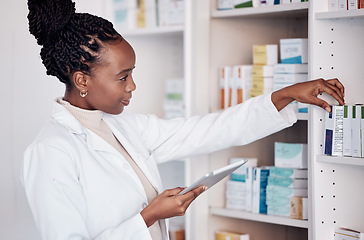 Image showing Pharmacy, pharmacist and digital tablet on medicine shelf, healthcare inventory and boxes or stock management. Medical woman or doctor with pills, product or tablet package for e commerce technology