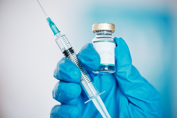 Image showing Hand, vaccine and syringe with a doctor in the hospital closeup for healthcare or medication. Medical, injection and treatment with a medicine professional in a clinic for innovation or cure