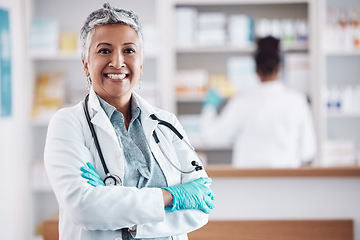 Image showing Senior, woman and doctor, portrait with arms crossed and healthcare, medical professional and hospital dispensary. Pharmacy, health and confidence, smile with wellness and drugs, medicine and service
