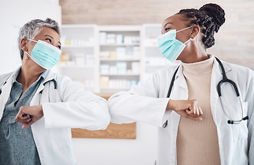 Image showing People, doctor and face mask in elbow greeting, meeting or handshake in social distancing at hospital. Women, medical or healthcare team touching arms in regulations, pandemic or health and safety