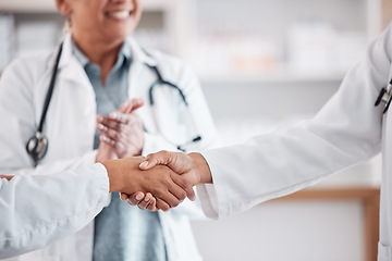 Image showing Clapping, teamwork or doctors shaking hands for success, good job or promotion goal in a hospital meeting. Closeup, congratulations or proud healthcare worker with handshake for medical collaboration