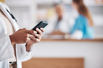 Image showing Pharmacist with phone, typing in clinic and medical information research, email or online chat. Smartphone, networking and mockup, woman doctor in pharmacy checking social media or internet news.