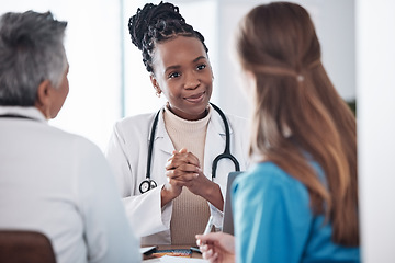 Image showing Teamwork, doctors or black woman in meeting or discussion for hospital schedule or collaboration. Leadership, group or nurses talking or speaking of medical healthcare research, report or news update