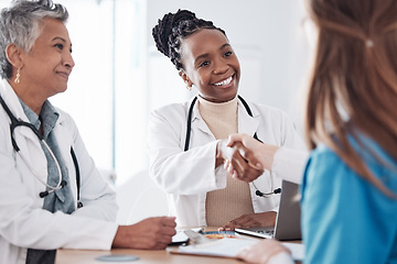 Image showing Happy nurses, teamwork or doctors shaking hands for interview, good job or promotion success in meeting. Hospital, congratulations or proud healthcare worker with handshake for medical collaboration