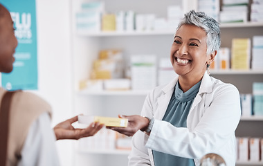 Image showing Pharmacist, medicine or patient with pills, supplements to patient in customer services help desk. Pharmacy, smile or mature doctor giving woman medical product or medication box in retail healthcare