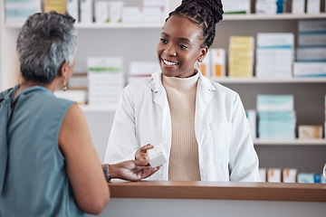 Image showing Pharmacist, pharmacy and customer for medicine service, healthcare advice and clinic solution or support by counter. African doctor, women or medical people with box of pills, product or retail drugs