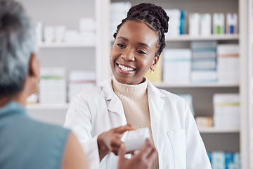 Image showing Pharmacist, medicine or black woman with pills supplements for patient for wellness or help. Pharmacy, smile or doctor giving a mature woman medical product or medication box in retail healthcare