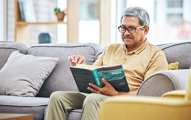 Image showing Home, relax and senior man with a book, retirement and calm with a story in a living room. Old person, calm and pensioner in a lounge, novel or literature with a hobby, self help or reading on a sofa