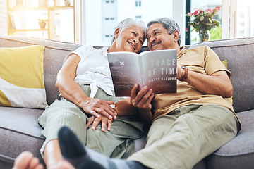 Image showing Senior, relax and a couple reading a book on the sofa for learning together. Smile, love and an elderly man and woman with a novel or story on a home living room couch for knowledge in retirement