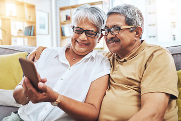 Image showing Senior couple, smile and phone on sofa for social media, reading digital news and notification with glasses. Happy elderly man, woman and scroll on smartphone for app, website and relax in retirement