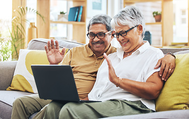 Image showing Senior couple, video call and laptop in home with voip communication, digital chat and talk. Happy man, woman and wave hello on computer in virtual conversation, online contact and retirement on sofa