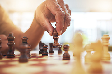 Image showing Person, chess and hands with pawn on board game for strategy, challenge and learning tabletop brain games. Closeup, chessboard and player moving pieces for winning contest, competition and fun hobby