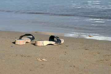 Image showing closeup slippers sea