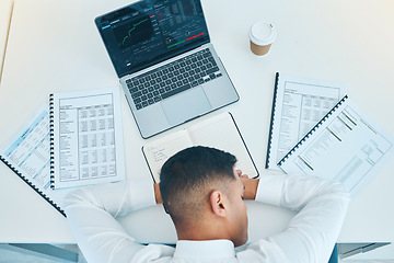 Image showing Business man, sleep on desk with trader, laptop and stock market, paperwork with statistics information and fatigue. Insomnia, overworked and burnout, data analysis and top with finance and analytics