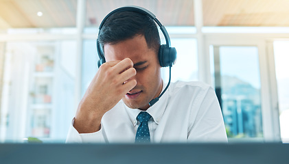 Image showing Business man, call center and headache, stress or pain for communication fail, financial mistake or job fatigue. Tired agent, consultant or sales person with anxiety or depression on office computer