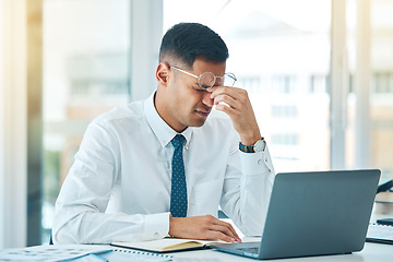 Image showing Business man, headache and stress on laptop for financial mistake, accounting error or results and pain. Professional person with glasses, tired and fatigue on computer for research and job report