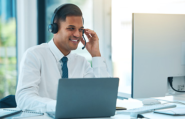 Image showing Call center, computer and man in customer service, happy and help desk support in office. Laptop, telemarketing and sales agent in communication, consulting or listening to contact us in crm business