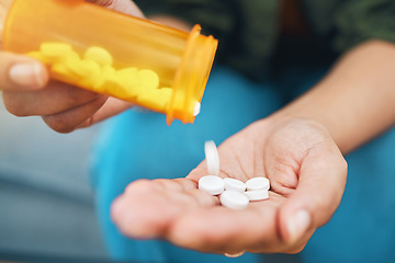 Image showing Hand, bottle and pills, closeup of drugs for health and sick person, wellness supplements and vitamins. Healthcare, pharmaceutical tablet and plastic container, antibiotics and treatment for illness