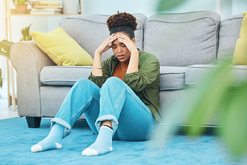 Image showing Woman, home and headache, stress or sad for mortgage, rent or debt, financial mistake and crisis on floor. Young african person with depression, pain and fatigue for student loan in living room