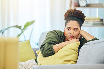 Image showing Thinking, tired and black woman on the sofa with depression, anxiety or sad from a breakup. House, young and an African girl on the living room couch with an idea after job fail, mistake or divorce