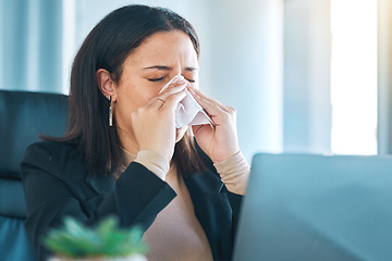 Image showing Tissue, sneeze and blowing nose with a business woman in her office for sick leave from a corporate company. Health, allergy or cold and flu virus with a young employee in her professional workplace