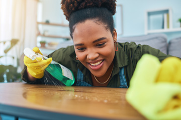 Image showing Smile, woman and cleaning table with gloves, spray bottle and soap detergent, housekeeping in home or hotel. Housework, smudge and housekeeper or cleaner service washing dirt off counter in apartment