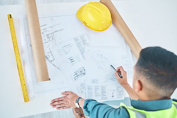 Image showing Blueprint, top view architect and planning man, engineer or developer reading floor plan of property design. Architecture, contractor inspection or engineering analysis of infrastructure illustration