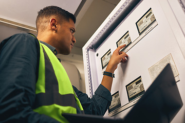 Image showing Man, maintenance and control room with laptop, electrician with inspection and fixing electricity supply. Check power grid, pc software and engineering, fuse box and technician with quality assurance