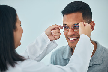 Image showing Glasses, eye care and vision, optometrist and patient with help and eyewear choice, prescription and lens. Wire frame, smile and people at optometry clinic during consultation, healthcare and test