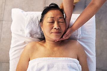 Image showing Facial, head massage and senior with woman in spa for wellness, treatment and hospitality. Peace, cosmetics and face of customer and masseuse hands in hotel for health, vacation and beauty salon