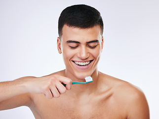 Image showing Happy man, toothbrush and dental care in hygiene, grooming or brushing teeth against a white studio background. Male person with big smile or toothpaste in tooth whitening, cleaning or oral treatment