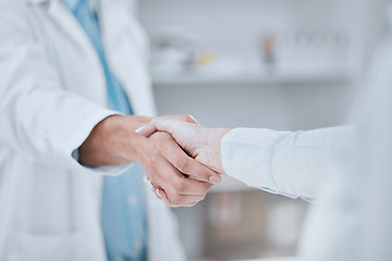 Image showing People, pharmacist and handshake in meeting, teamwork or agreement together for deal at pharmacy. Closeup of medical or healthcare team shaking hands in support, unity or thank you at the drugstore