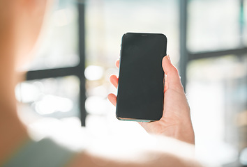 Image showing Woman, hand and phone mockup in advertising, social media or online communication at home. Closeup of female person with mobile smartphone app, display or screen for research, texting or networking