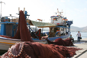 Image showing fishermen by the ship