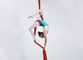 Image showing Aerial, woman gymnast fitness and sport performance with girl flexibility and athlete with white background. Workout, exercise and gymnastics with balance, art and dance with acrobat competition