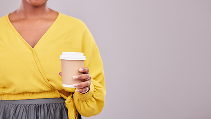 Image showing Hand, coffee and mockup with a woman in studio on a gray background for morning caffeine in a cup. Cafe, space or takeaway beverage with a person closeup on empty or blank mock up for advertising