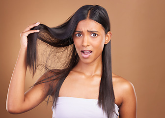 Image showing Beauty, crisis and portrait of woman with hair loss in studio worry, stress or anxiety for damage on brown background. Haircare, fail and lady model face with dry scalp problem, dandruff or alopecia