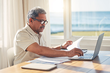 Image showing Senior man, laptop and documents in budget planning, schedule payment or checking bills at home. Mature male person working on computer, paperwork or expenses in finance, insurance or retirement plan