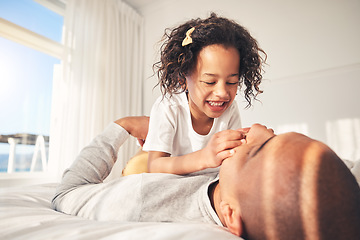 Image showing Play, happy or father with child on bed for a game in the morning with kid, care or love in family home. Single parent, playful or dad bonding with baby in bedroom to relax with smile, joy or freedom