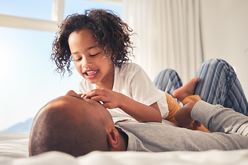 Image showing Play, morning or father with child on bed for a game together with trust, care or love in family home. Single parent, wake up or dad bonding with kid in bedroom to relax with smile, joy or freedom