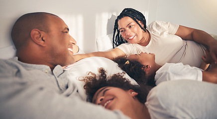 Image showing Family, morning and happy in home bedroom bed playing, bonding and gratitude for love. African woman, man and kids lying together for security, support or relax with mother and father on holiday