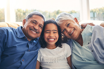 Image showing Grandparents, portrait and happy kid in home living room on sofa, bonding or having fun together. Face, grandmother and grandfather with child in lounge to relax with love, care and family connection