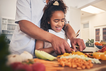 Image showing Cooking, vegetables and father with kid in the kitchen for child development, teaching and learning. Bonding, happy and dad helping girl to cut ingredients for a dinner, supper or lunch meal at home.