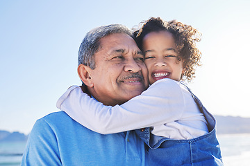 Image showing Grandfather, child and happy at the beach for vacation and travel together on outdoor holiday for happiness. Hug, smile and grandparent with kid or young grandchild by the ocean or sea for adventure